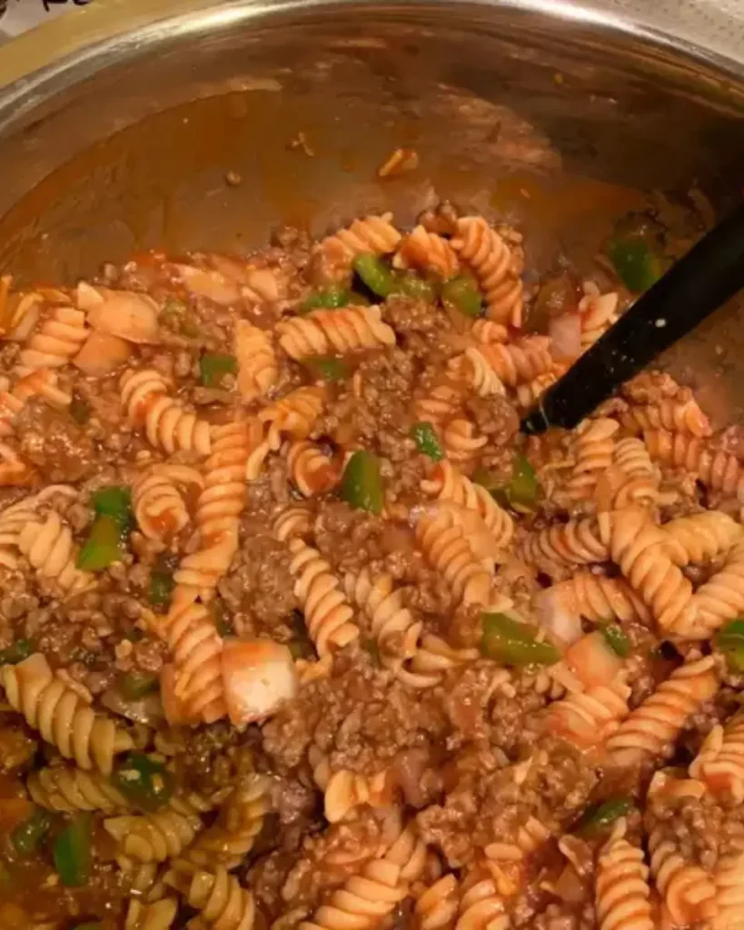 Pasta Casseroles That Warm the Heart – 5-Star Family Favorite 4 Browning beef and cooking pasta during casserole preparation